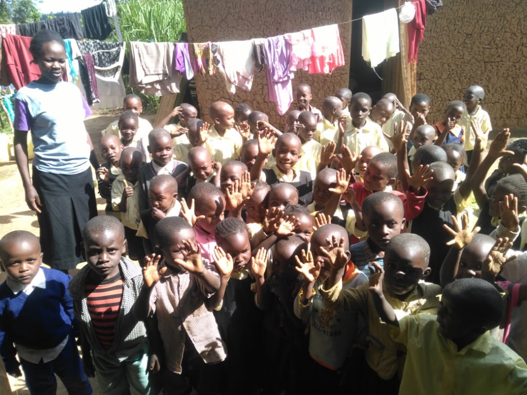 Children waving in Kakamega